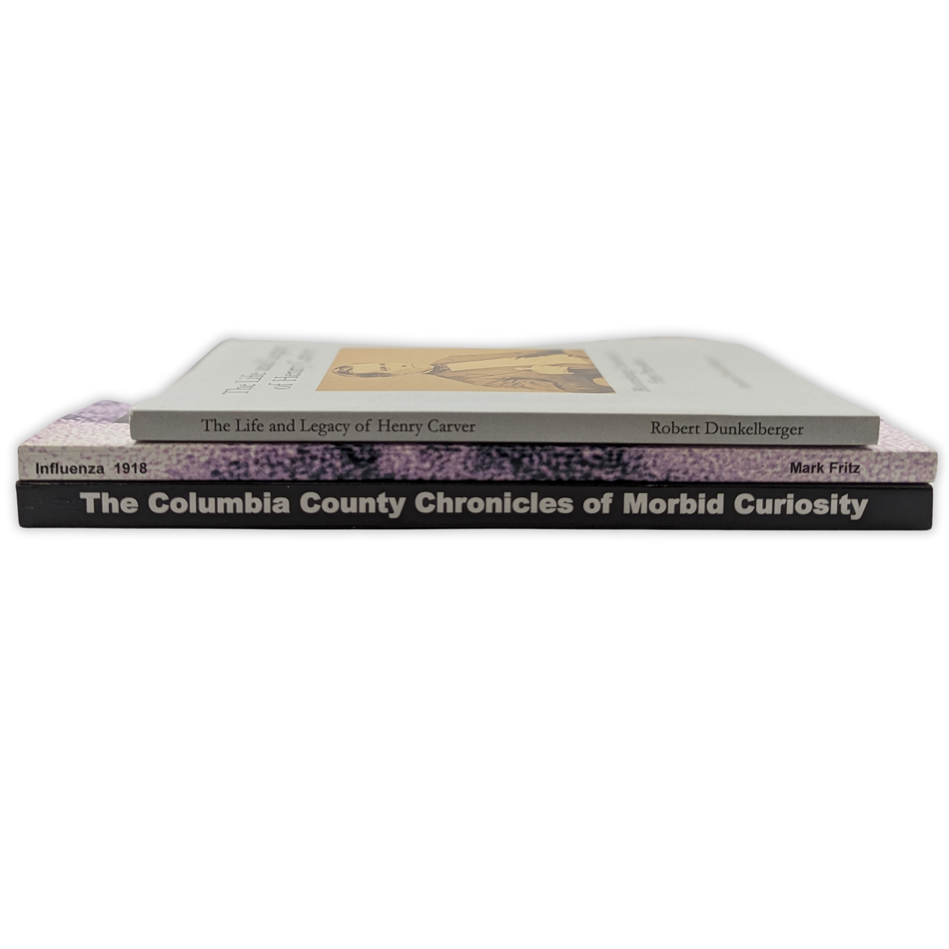 Three books are stacked on top of each other on a white background by press enterprise commercial printing