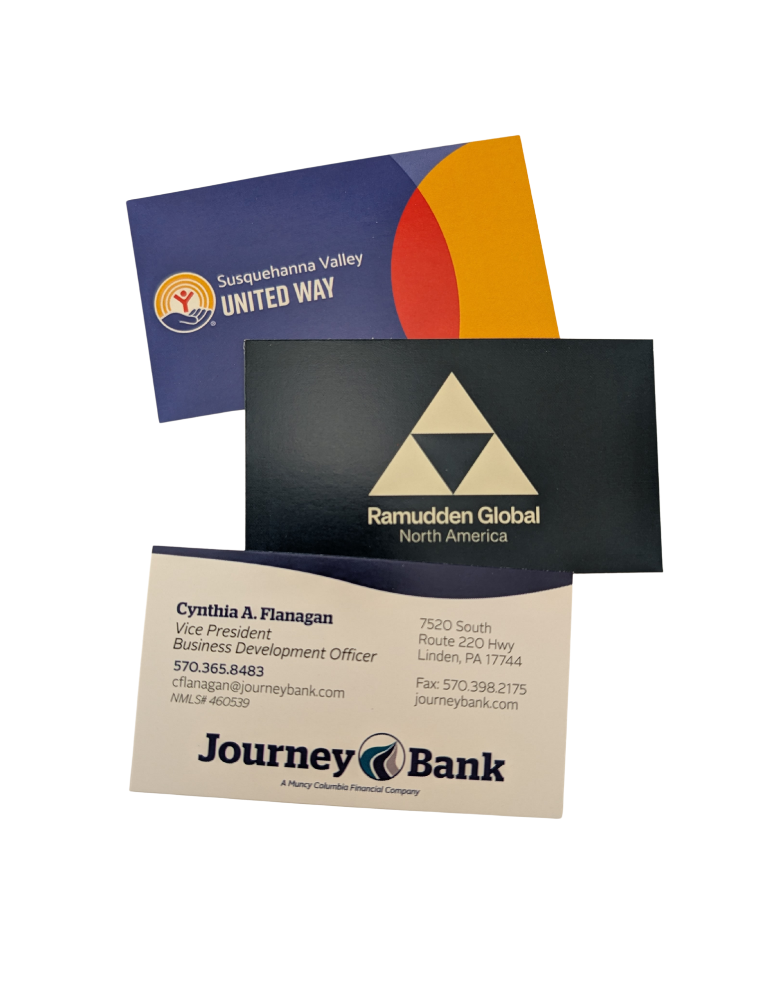 Three business cards stacked: United Way, Ramuddun Global, and Journey Bank.