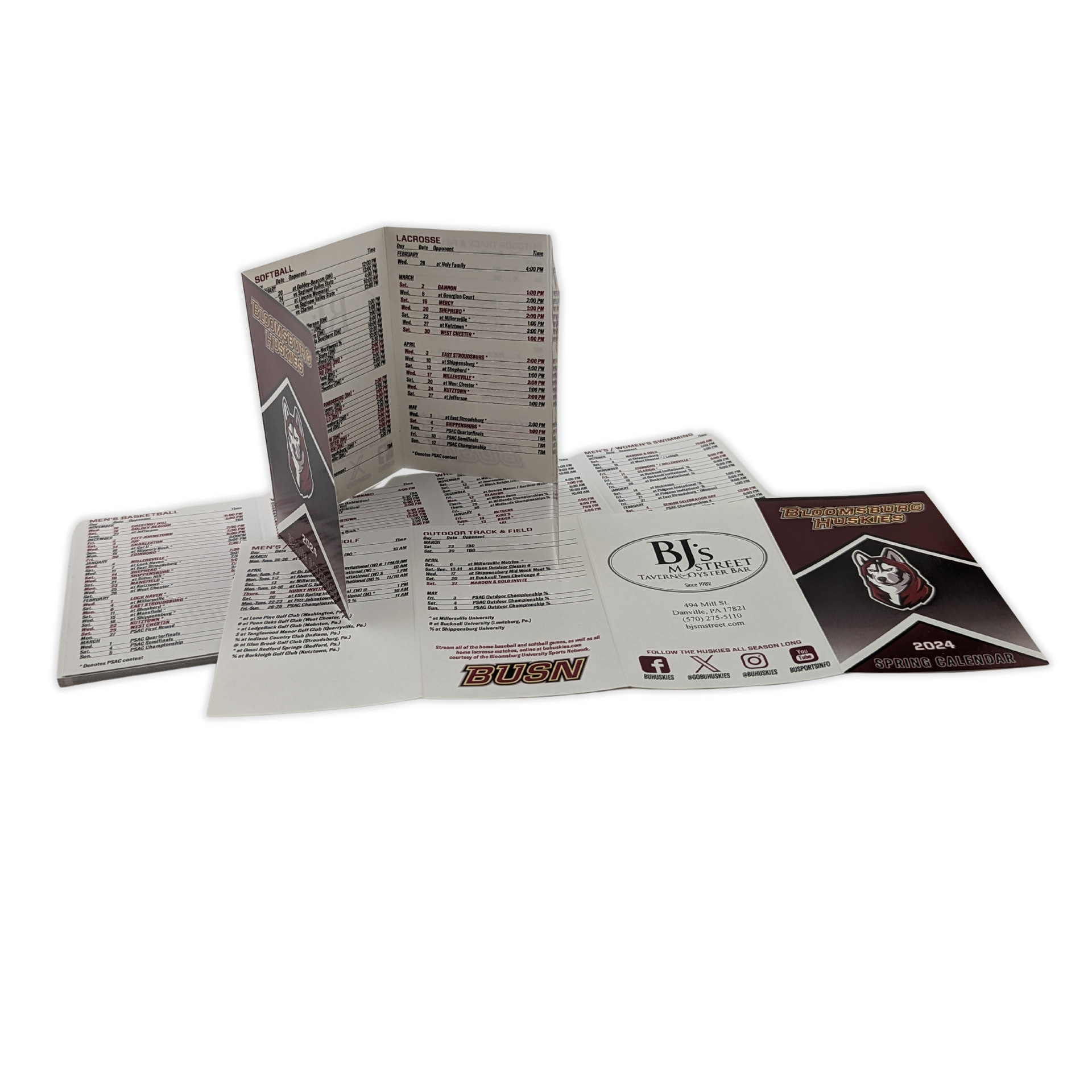 A group of brochures are stacked on top of each other on a white background by Press Enterprise Commercial Printing
