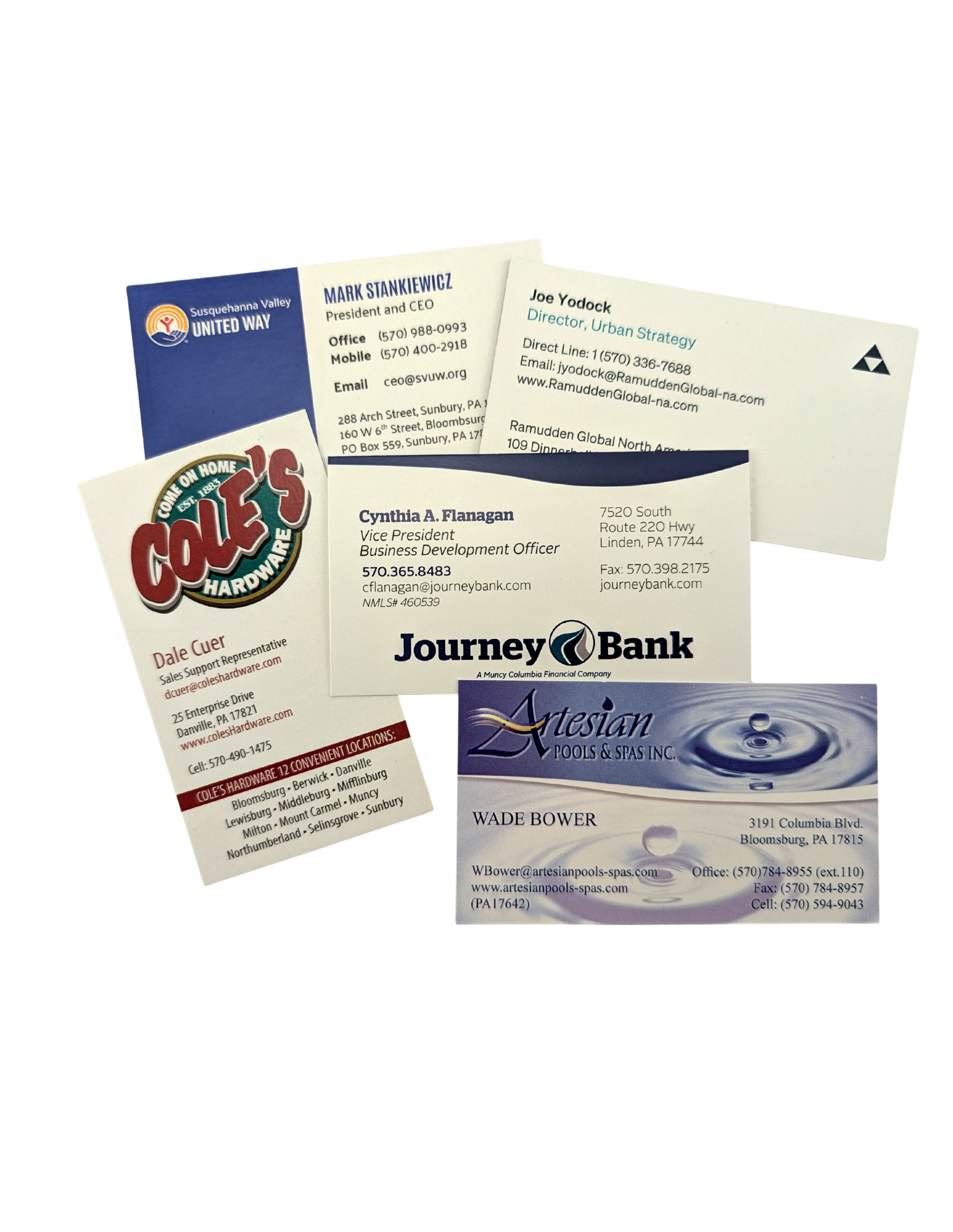 Pile of business cards featuring various logos and contact information.