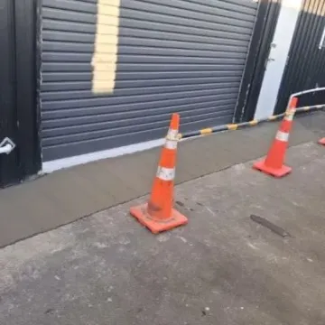 Concrete entrance roller door front view, CareVets veterinary clinic in Wainuiomata.