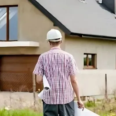 Hutt City Council inspector entering property for a retaining wall compliance inspection in Lower Hutt.