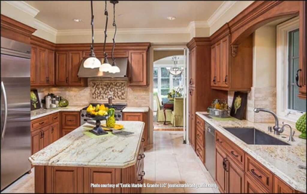 Kitchen with wood cabinets, island, granite countertops, and stainless steel appliances.