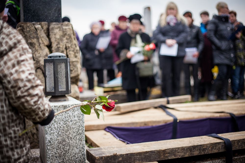 People at a Graveside Funeral; Casket, Red Rose, Headstone — Finlayson & McKenzie Funeral Directors in Rockhampton City, QLD
