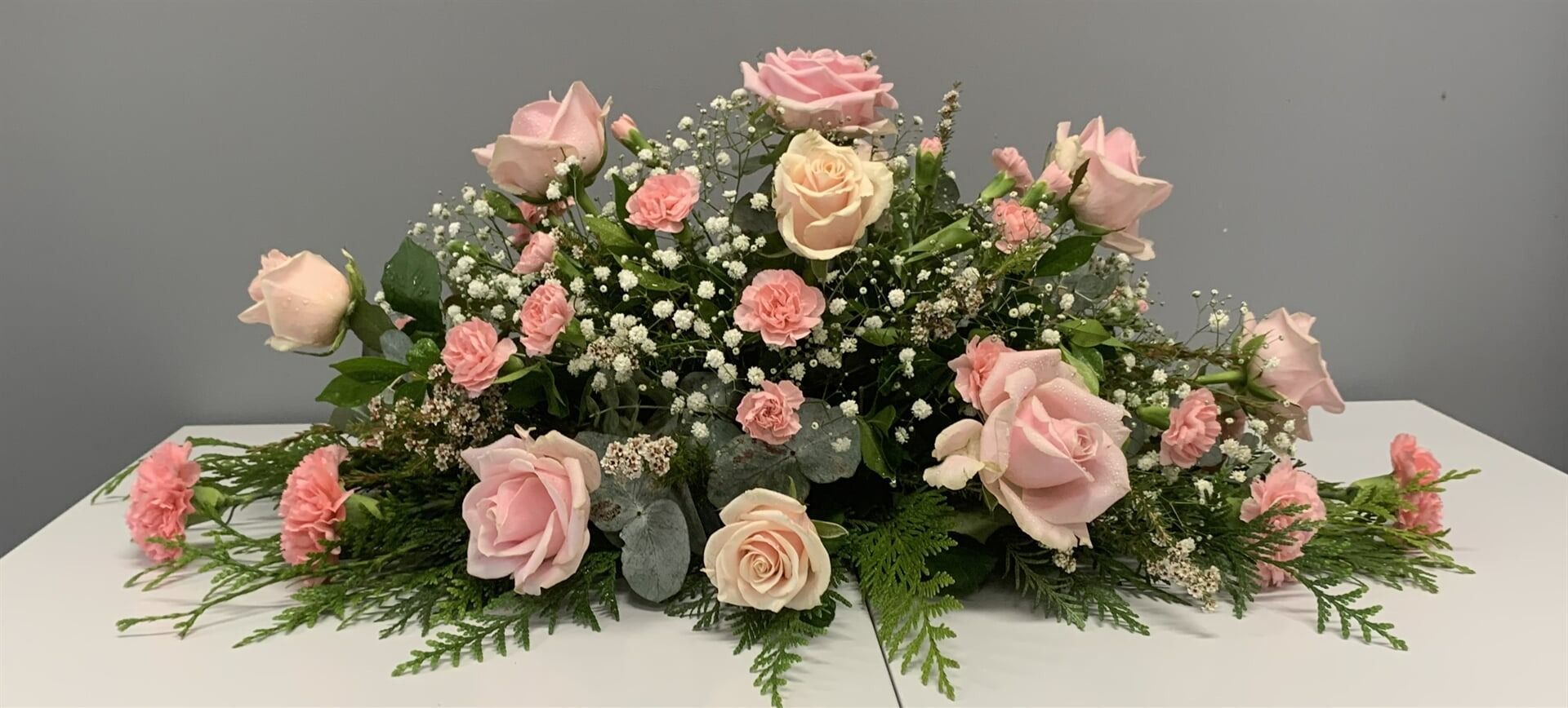 A Floral Arrangement of Pink Roses — Finlayson & McKenzie Funeral Directors in Rockhampton City, QLD
