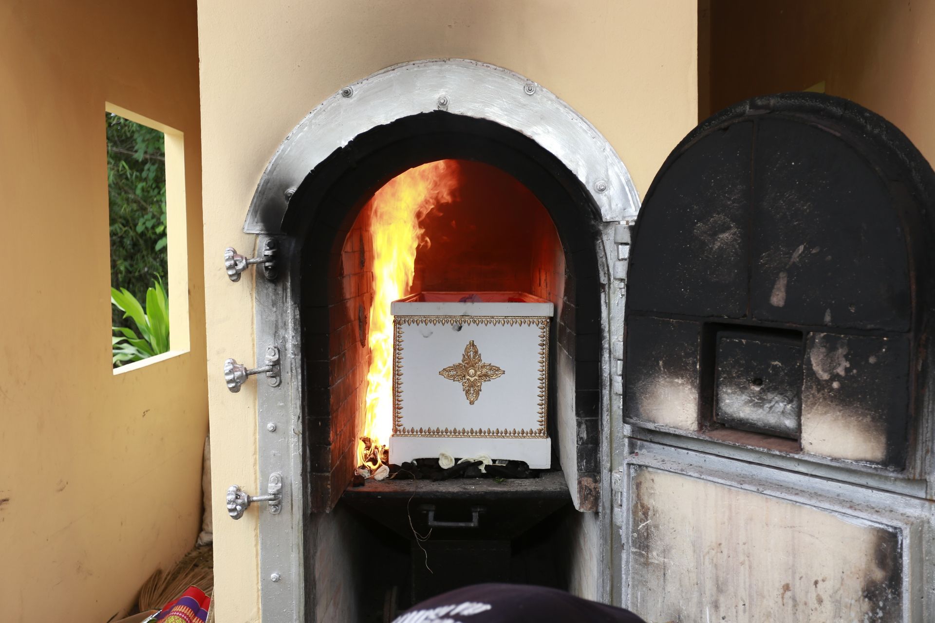 A Coffin Inside a Cremation Furnace — Finlayson & McKenzie Funeral Directors in Emu Park, QLD