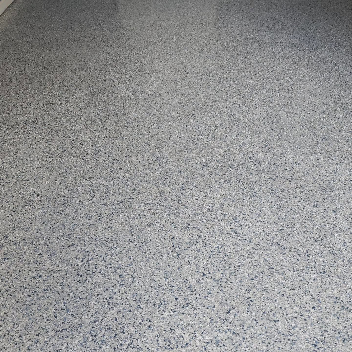 Close-up of a gray speckled carpet or floor surface