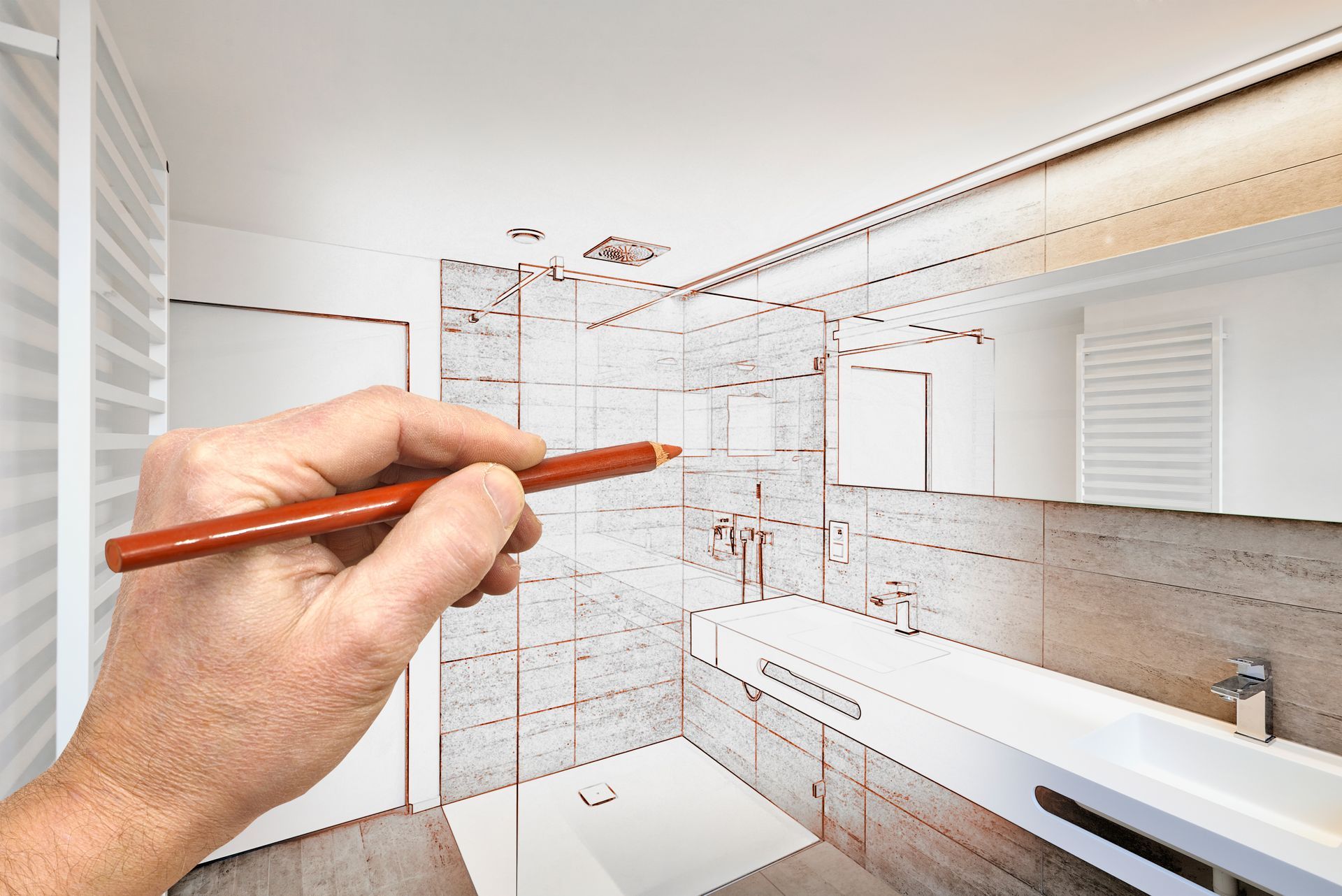 Hand drawing a modern bathroom renovation sketch over a finished interior.