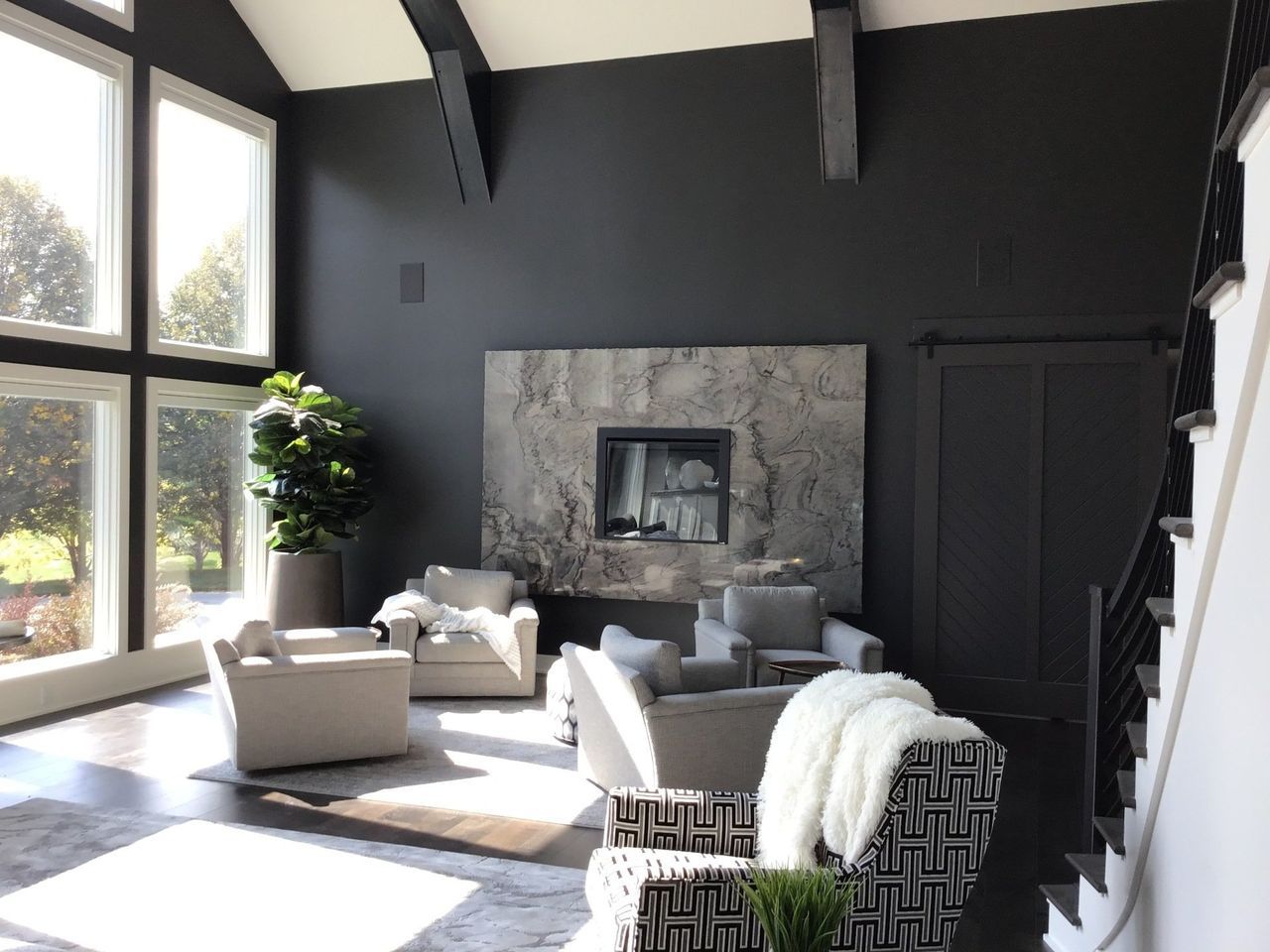 A Living Room With Black Walls And A Fireplace | Omaha, NE | DRD Home Services