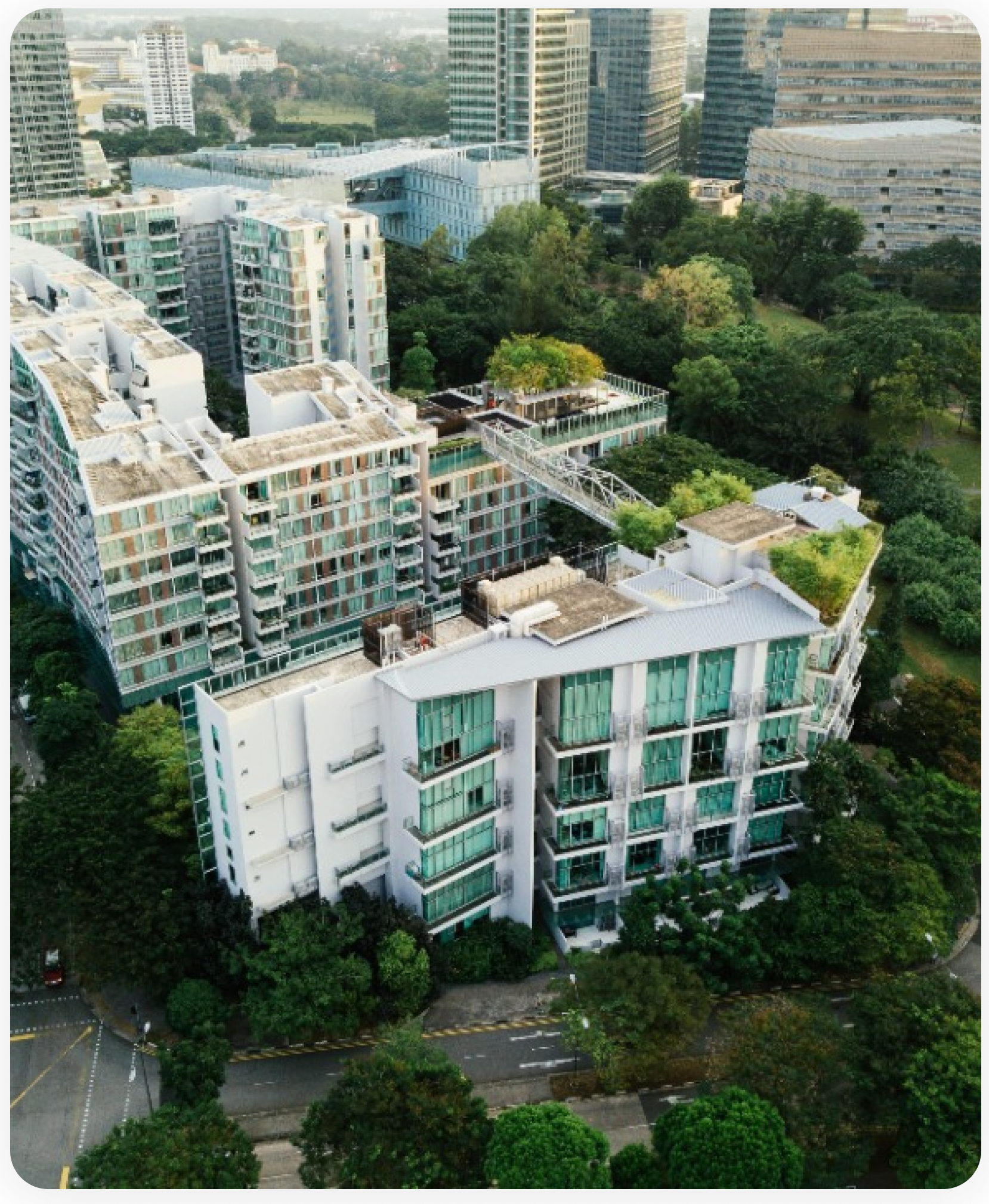 An aerial view of a city with lots of buildings and trees