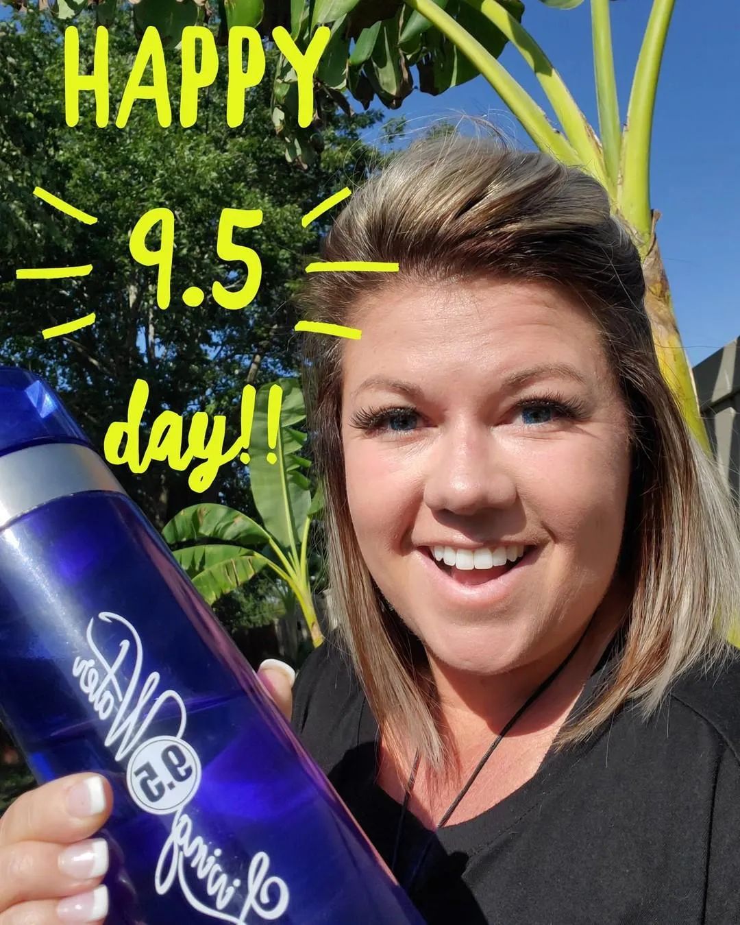 A Woman Holding a Purple Water Bottle — Chesterfield, MO — Our Free Water Store A Woman Holding a Purple Water Bottle — Chesterfield, MO — Our Free Water Store