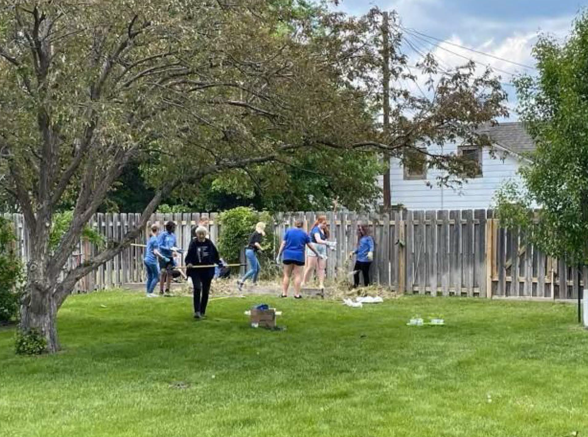student volunteers gardening