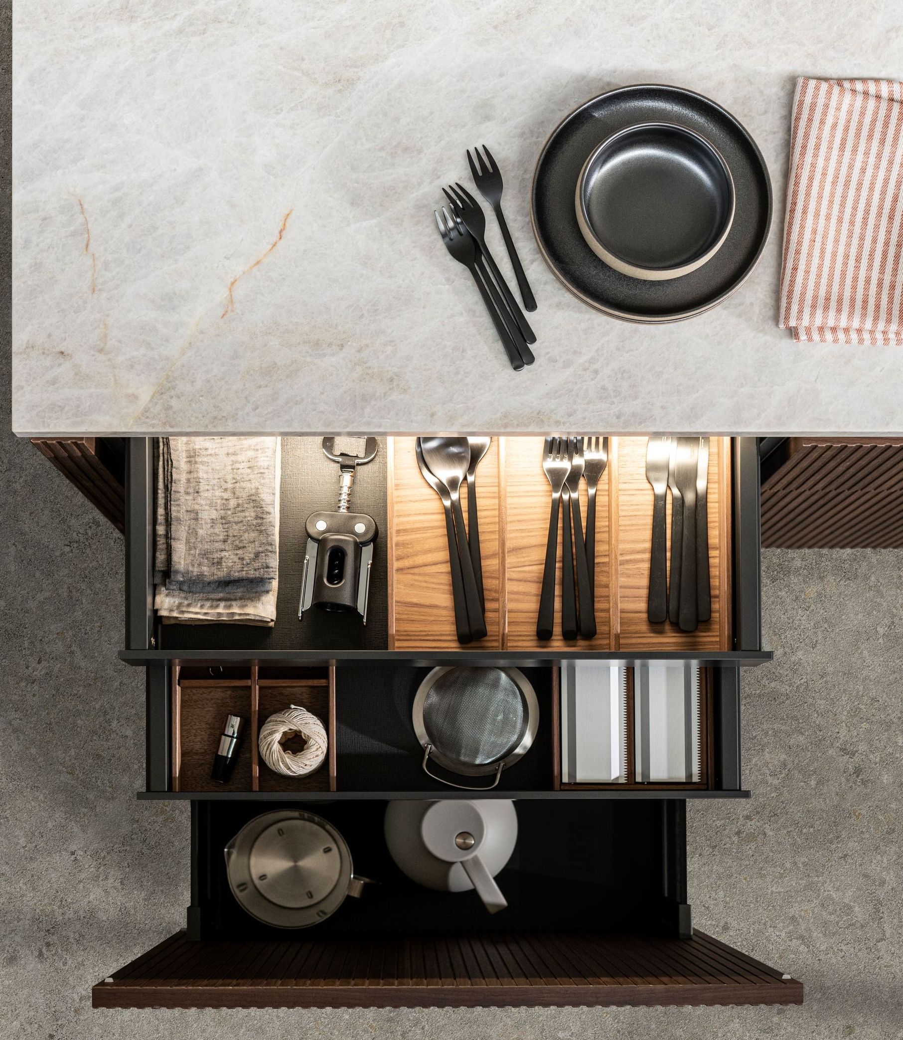 A man and a woman are standing next to each other in a kitchen.