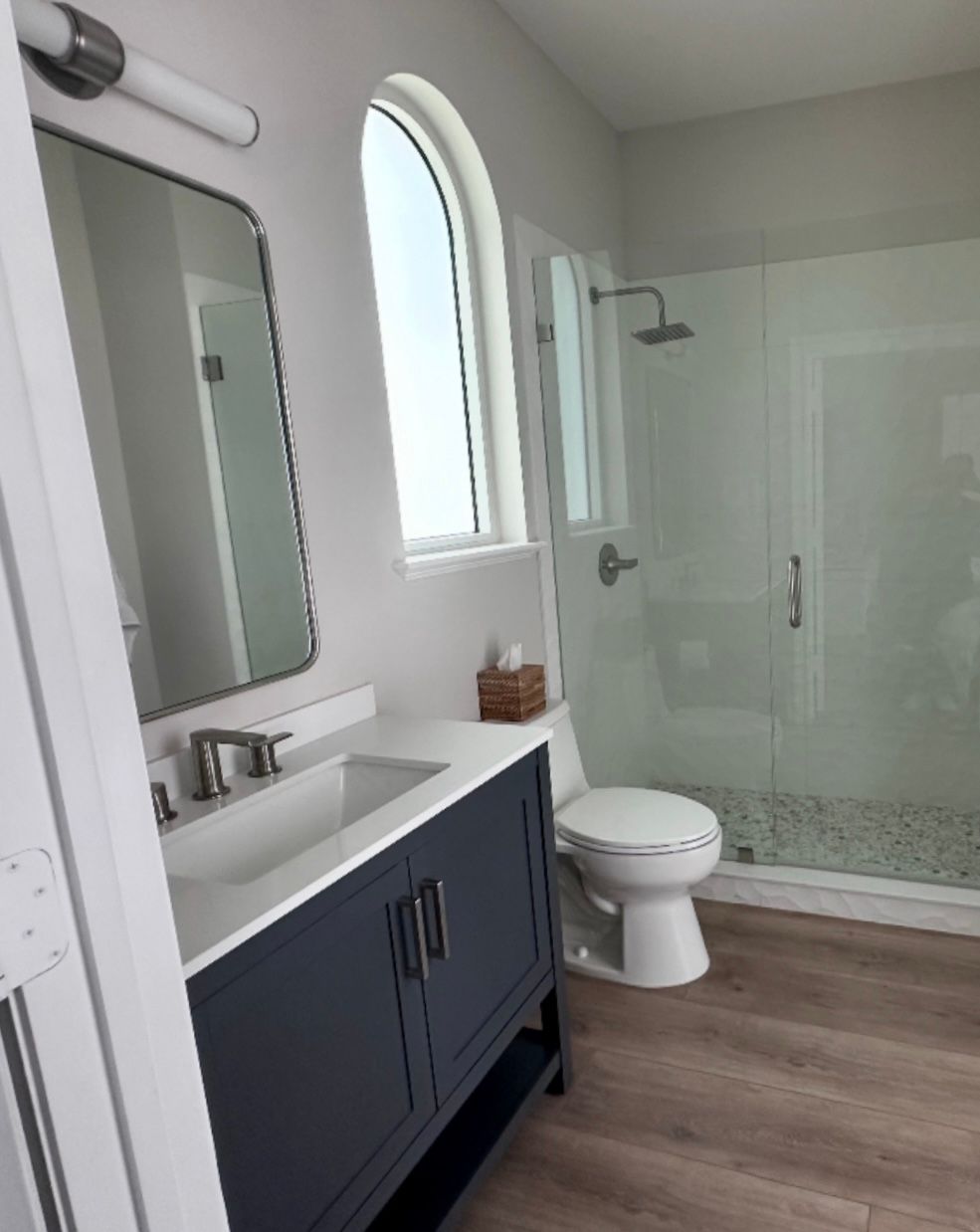 Bathroom with dark blue vanity