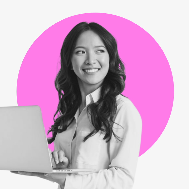A woman is holding a laptop computer in front of a pink circle.