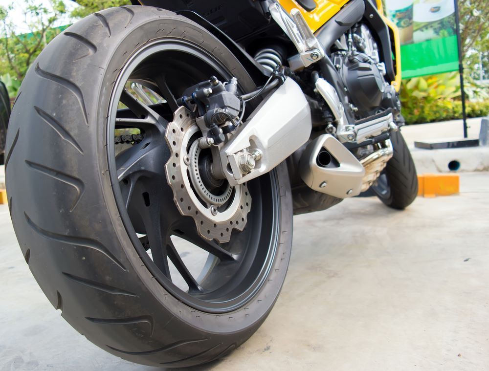 A Close Up of the Back Wheel of a Motorcycle — Aura Towing Service in Baringa, QLD