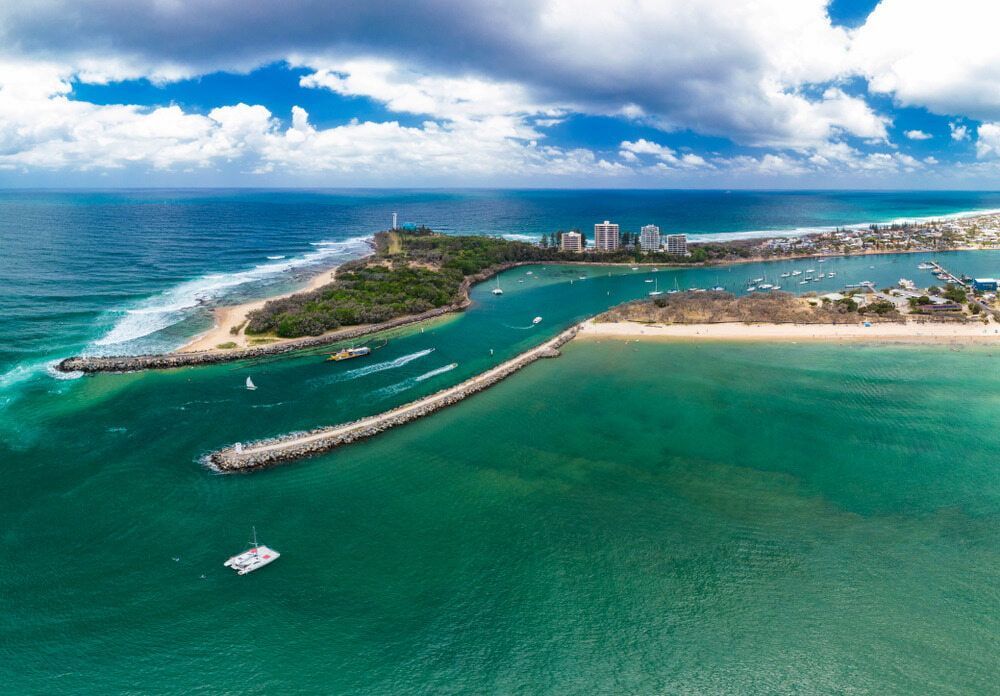 Aerial View of the Ocean, Harbor, and Coast With Buildings — Aura Towing Service in Banya, QLD