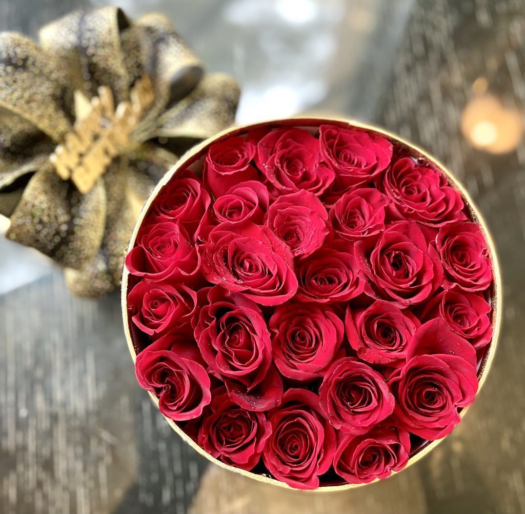 hat box of red roses