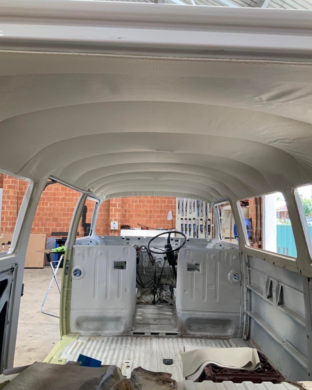 The Inside of a White Van is Being Built in a Garage — Simmons Glass & Trim In Bathurst, NSW