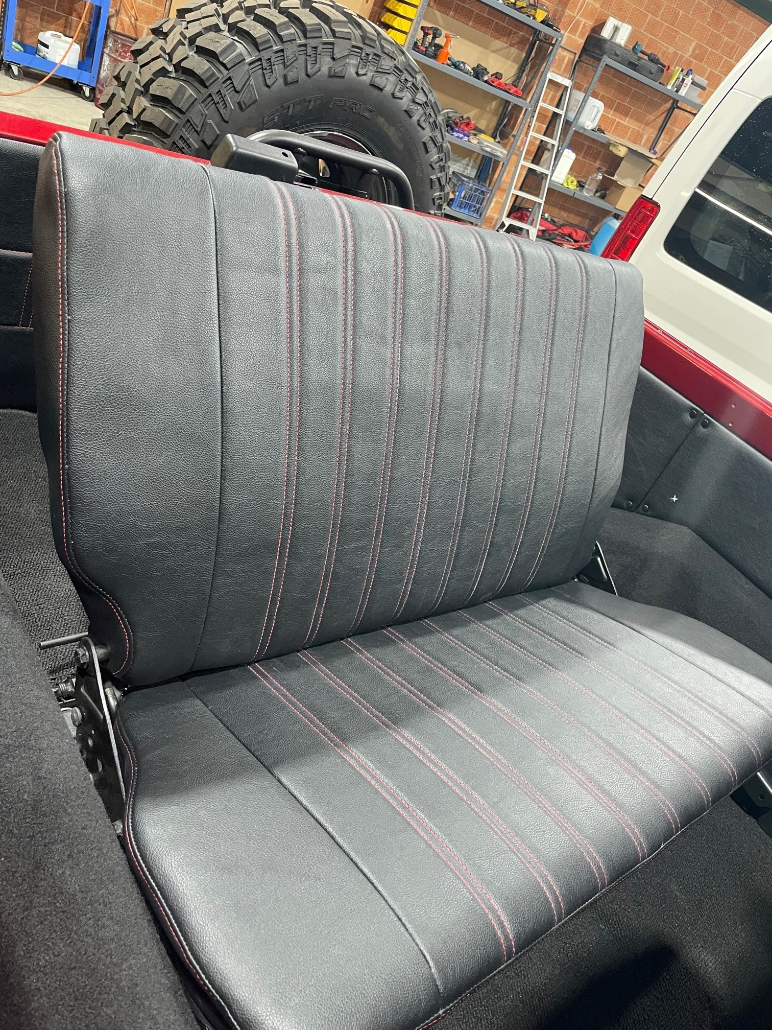 A Grey Seat Cover Of A Car — Simmons Glass & Trim In Bathurst, NSW
