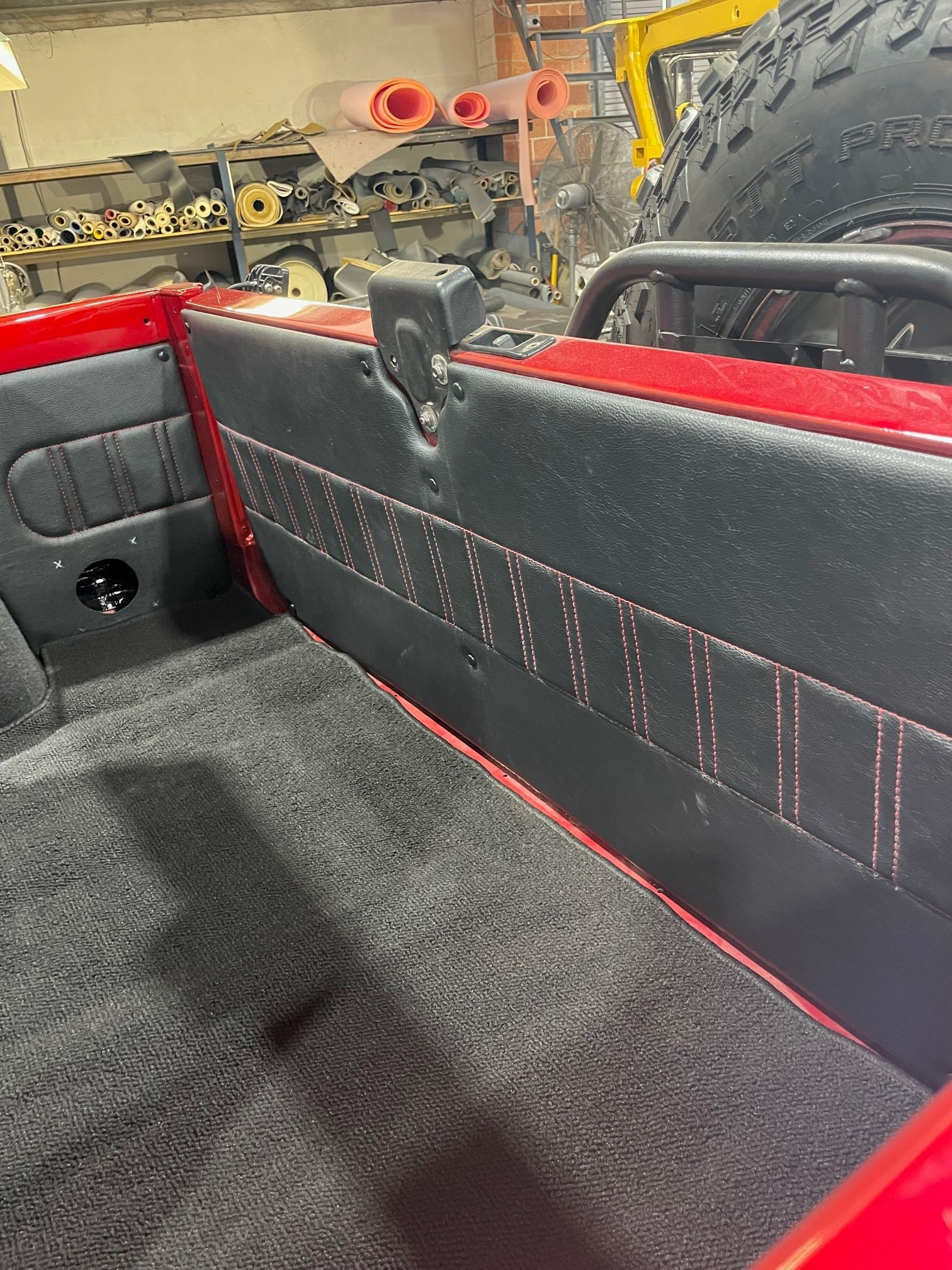 The Inside Of A Car With Dark Grey Covers And Red Trim — Simmons Glass & Trim In Bathurst, NSW