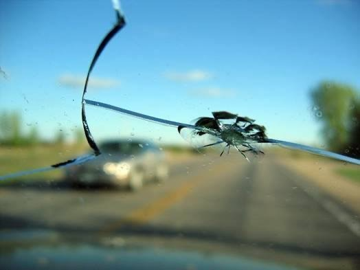 A Cracked Windscreen On A Car Driving On The Road — Simmons Glass & Trim In Bathurst, NSW