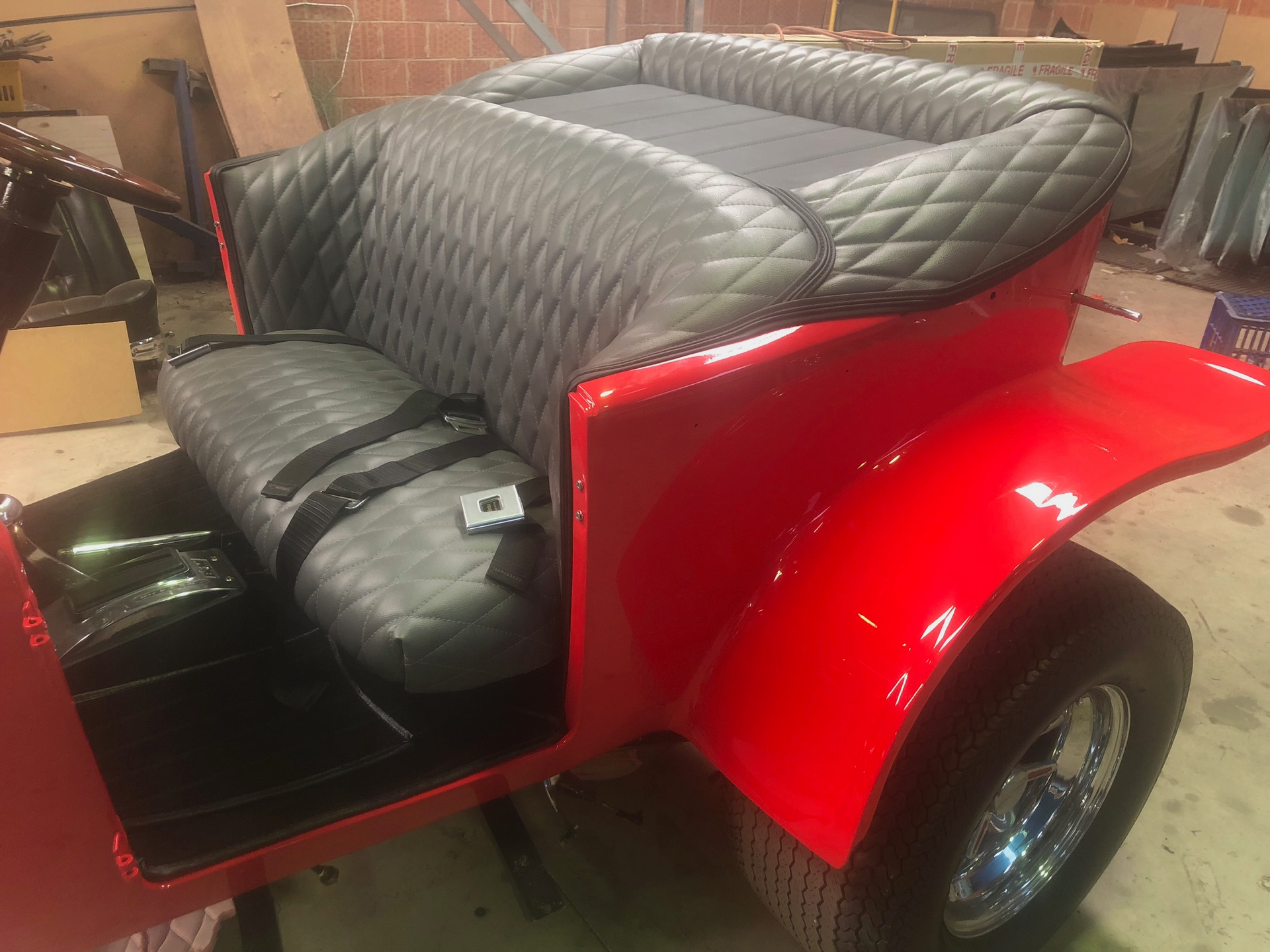 A Red Trailer With Black Seat Covers — Simmons Glass & Trim In Bathurst, NSW