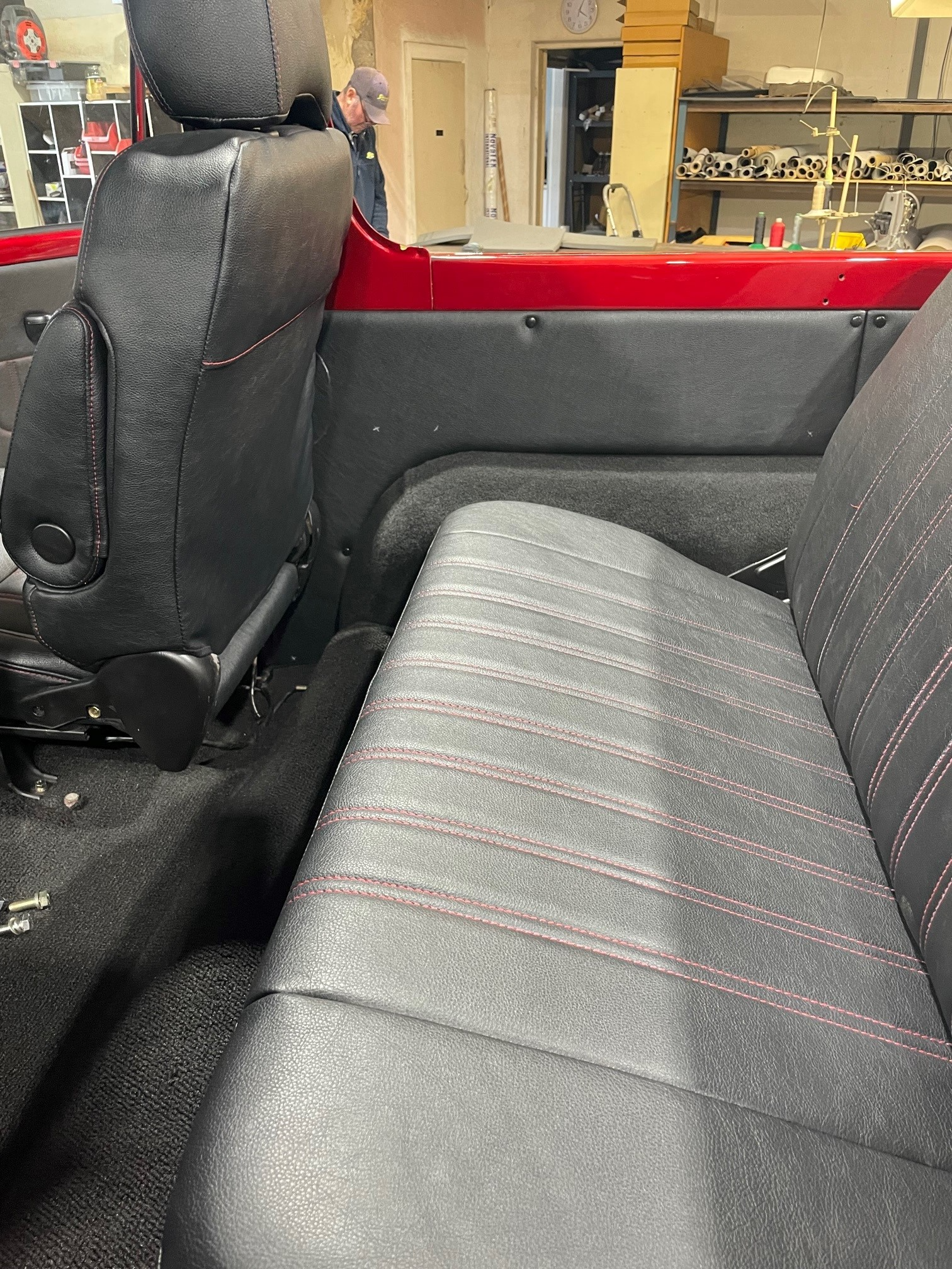 The Inside Of A Car With Dark Grey Covers And Red Trim — Simmons Glass & Trim In Bathurst, NSW