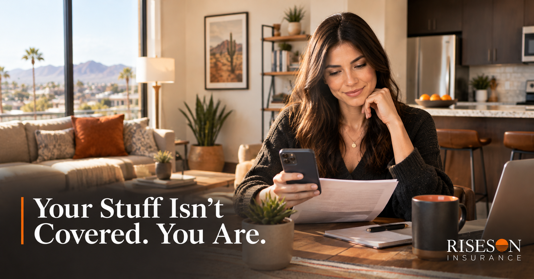 Young renter reviewing renters insurance documents in a modern Arizona apartment