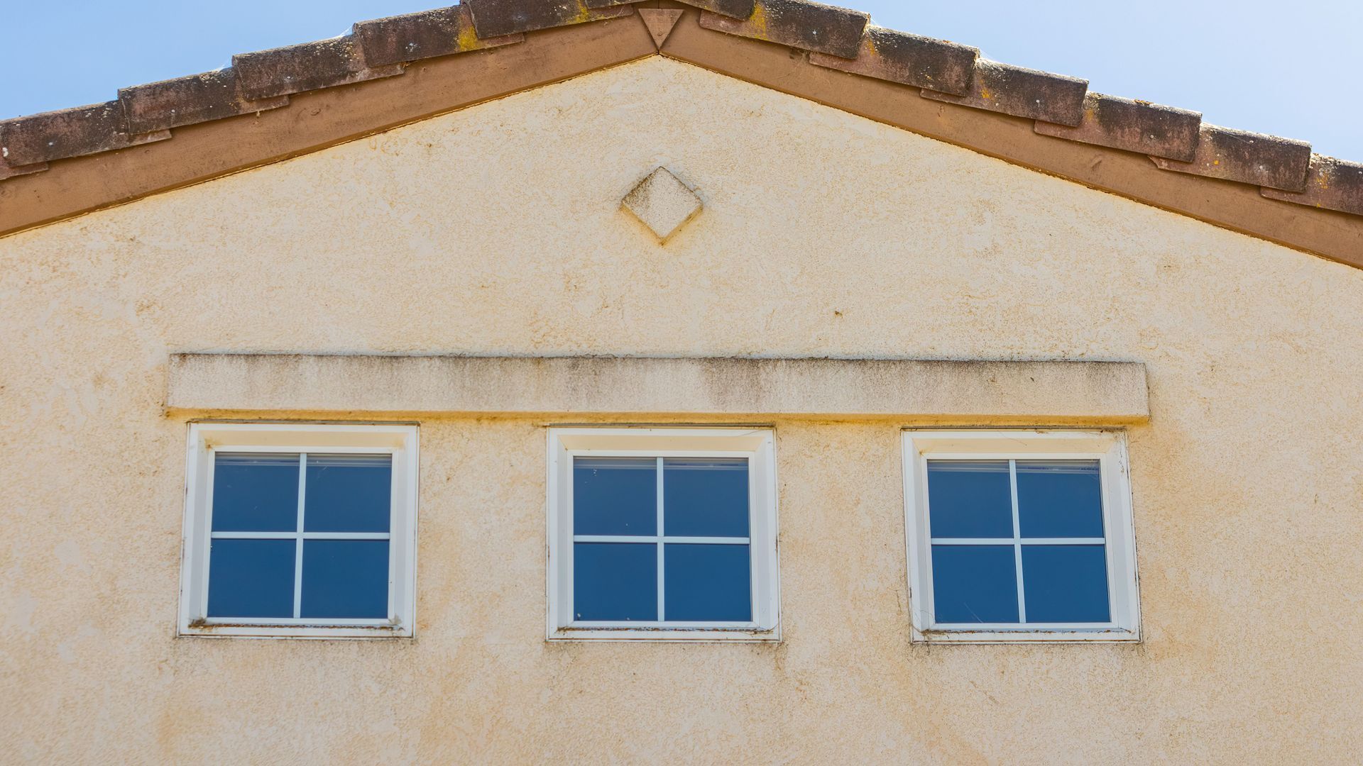 Arizona stucco home exterior showing dwelling coverage on a homeowners insurance policy
