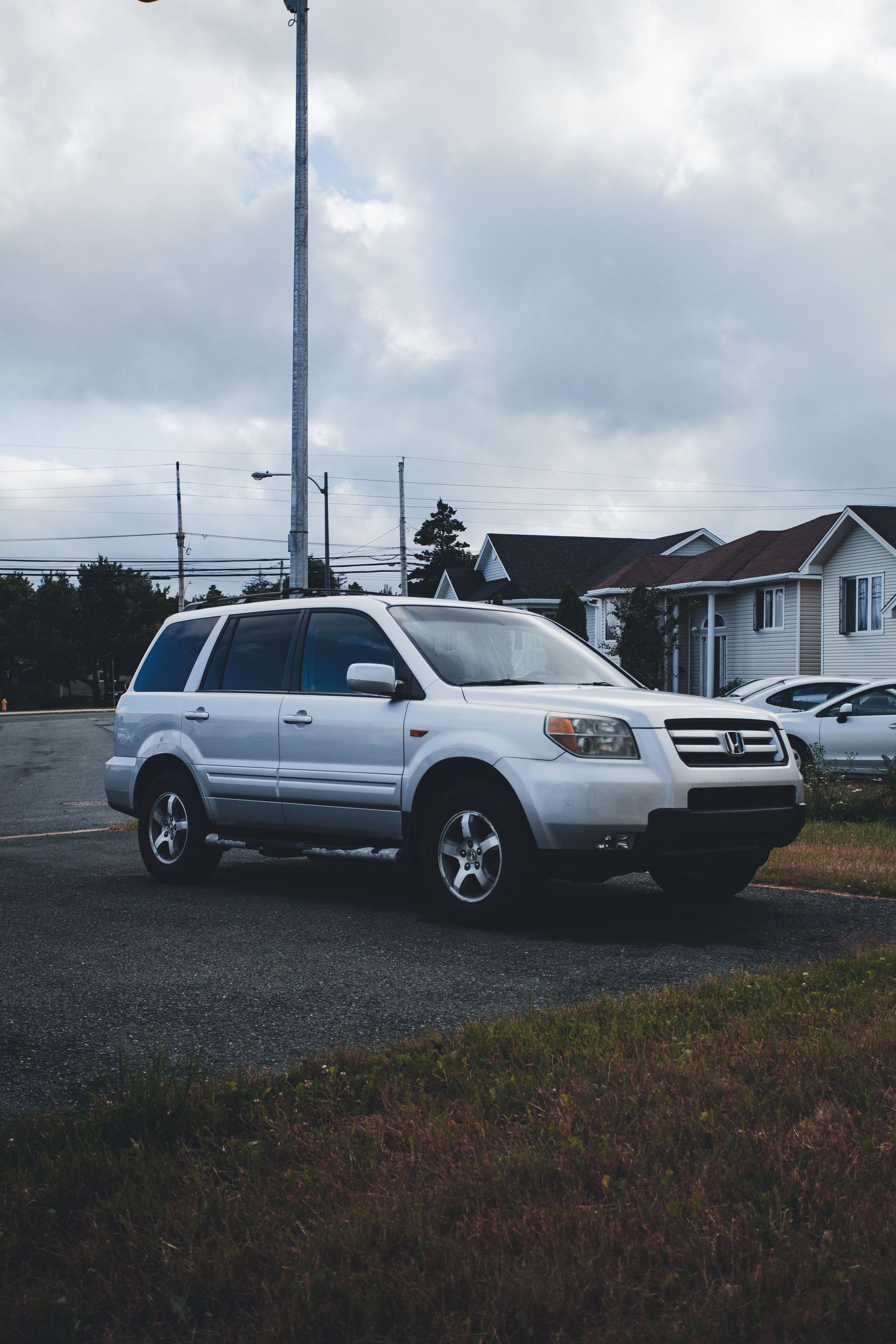 Family SUV parked in the driveway of a suburban Avondale, Arizona home, the kind of vehicle West Valley commuters insure