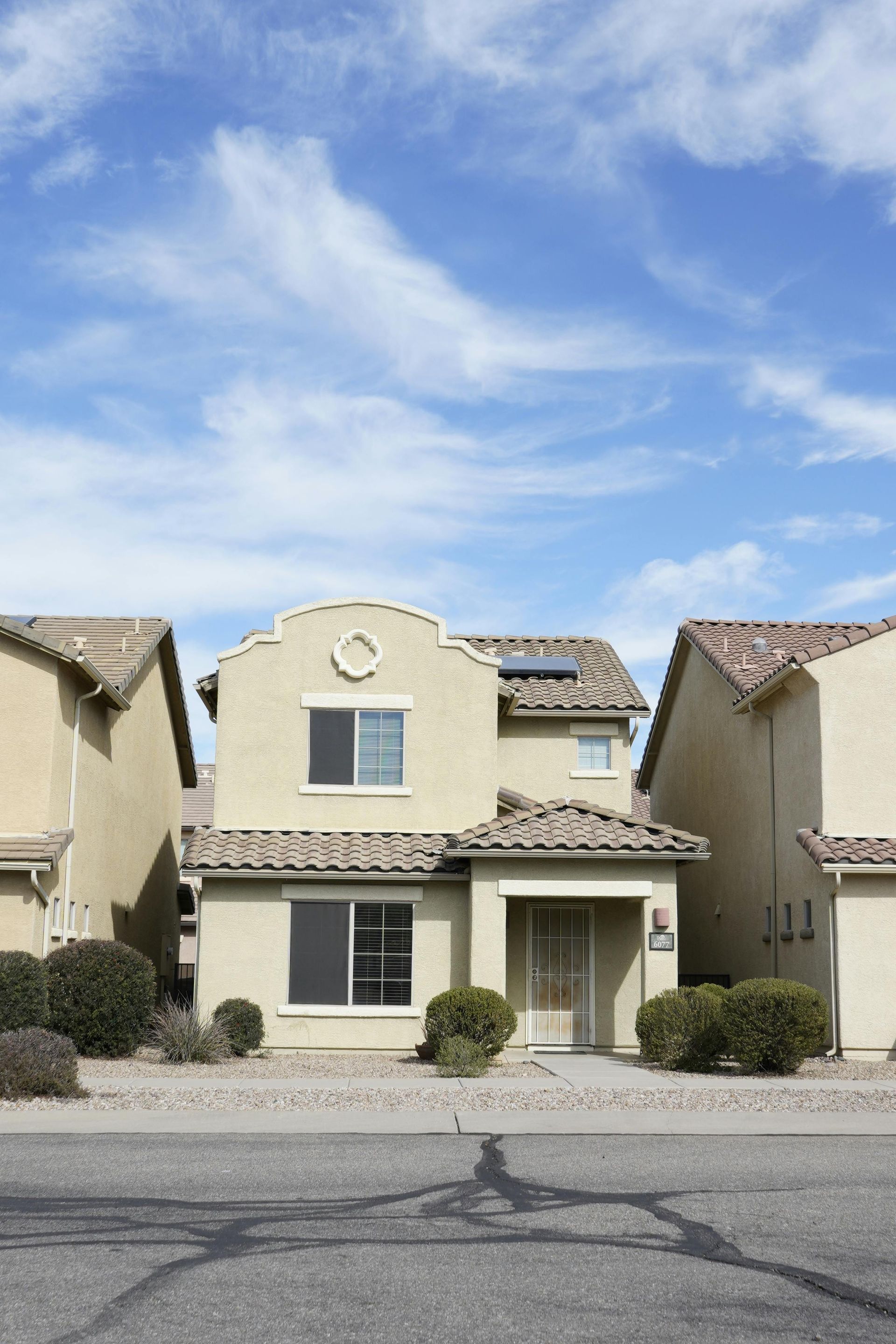 Modern stucco homes in Chandler, Arizona neighborhood representing East Valley home insurance coverage
