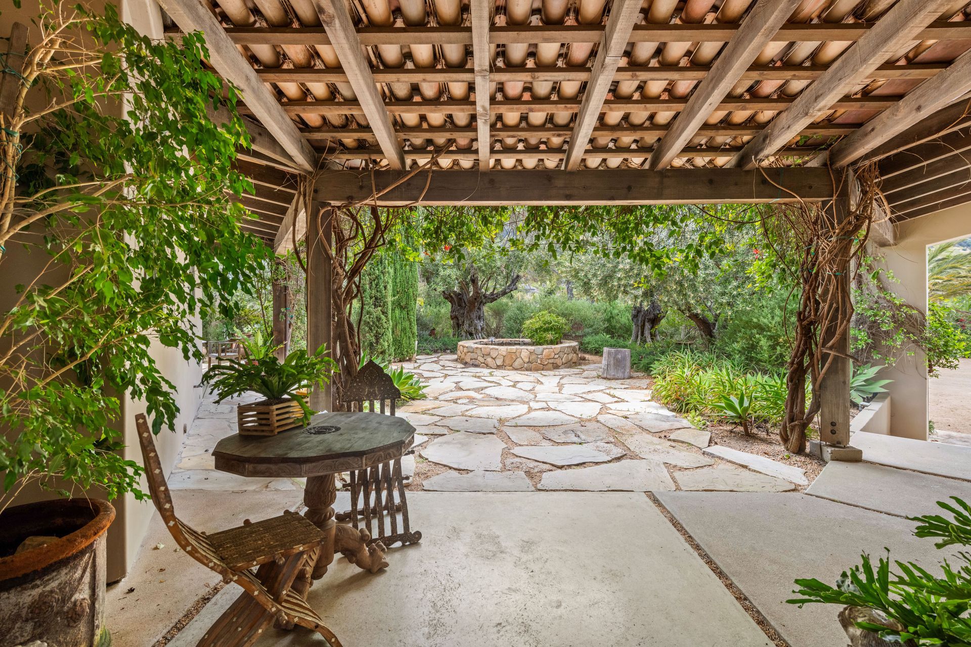 Shaded stone patio and pergola at an Arizona seasonal home