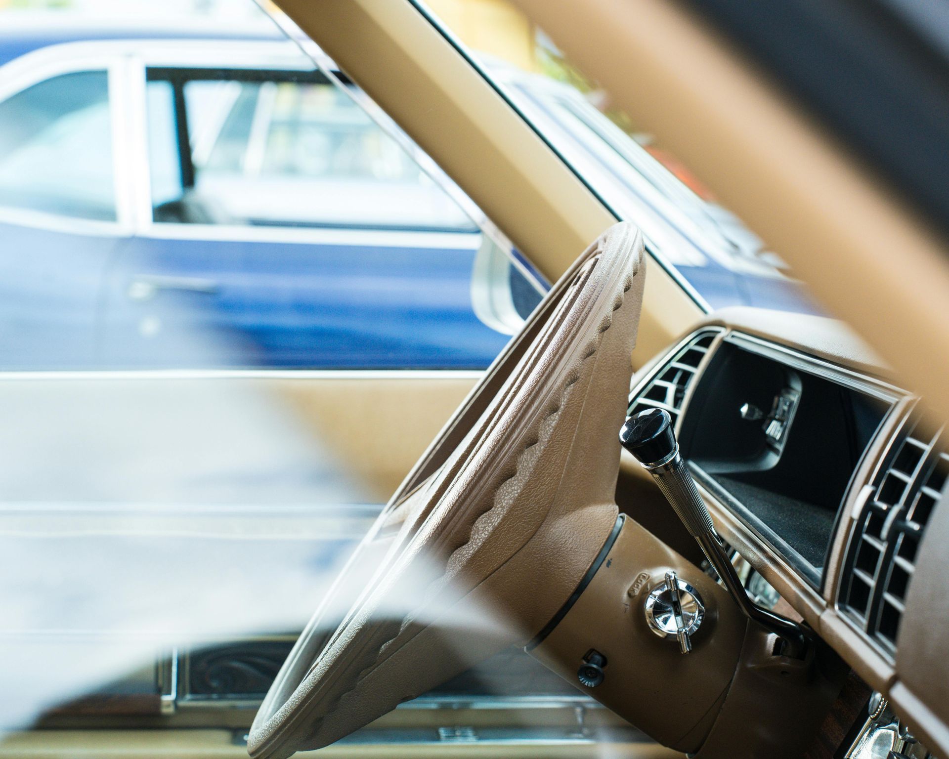 Vintage classic car interior dashboard showing steering wheel and gauges, representing classic car insurance in Arizona