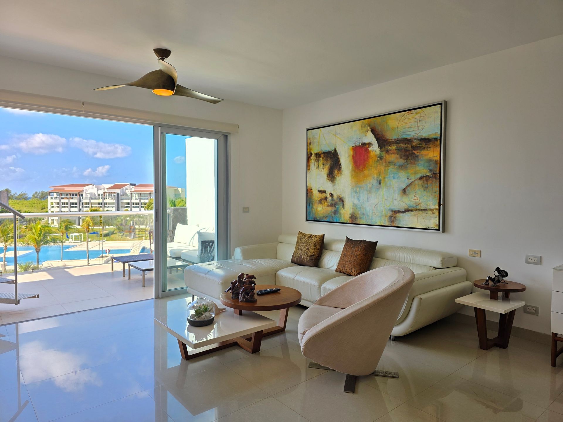 Bright Arizona condo living room opening to a pool courtyard, protected by an HO-6 condo policy