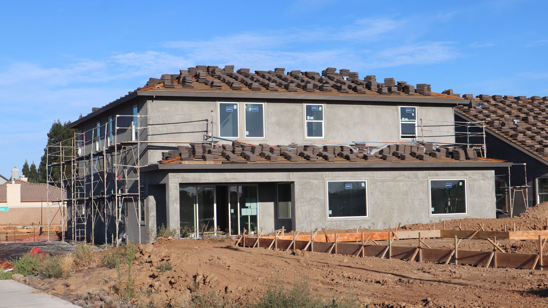 Arizona home with a tile roof under construction, showing home condition for insurance