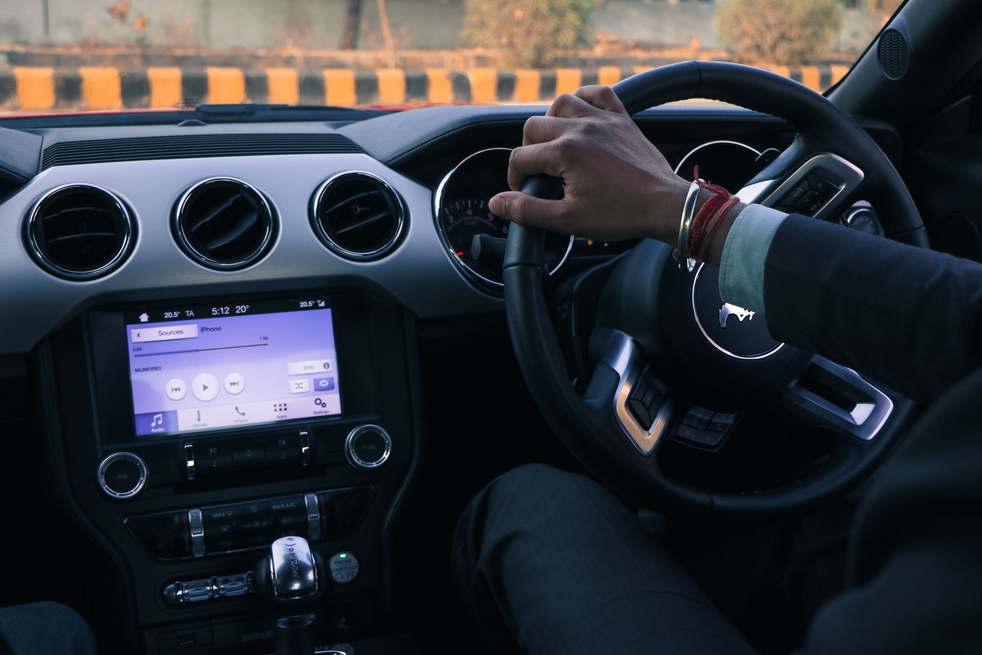 Driver hands on steering wheel, Arizona uninsured motorist coverage guide