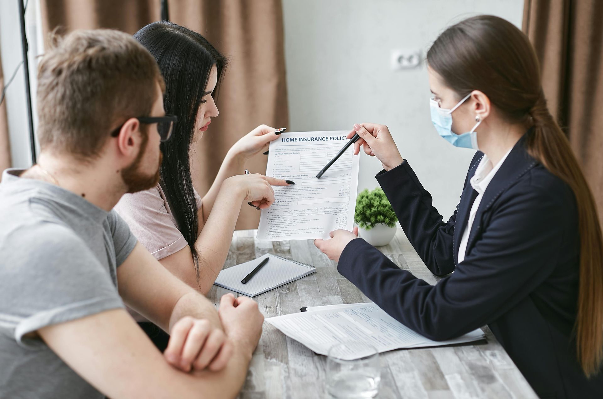Arizona couple reviewing home and auto insurance policy limits with an independent agent