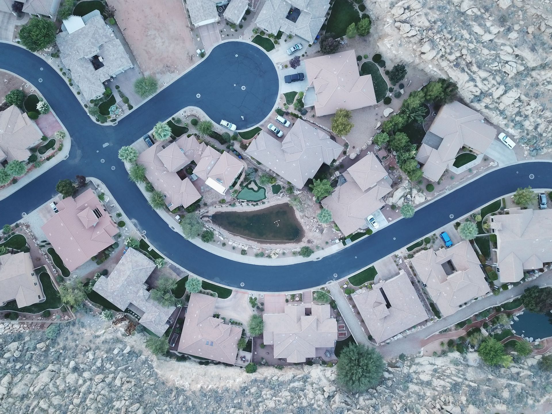 Aerial view of a suburban Arizona neighborhood cul-de-sac with homes covered by home insurance