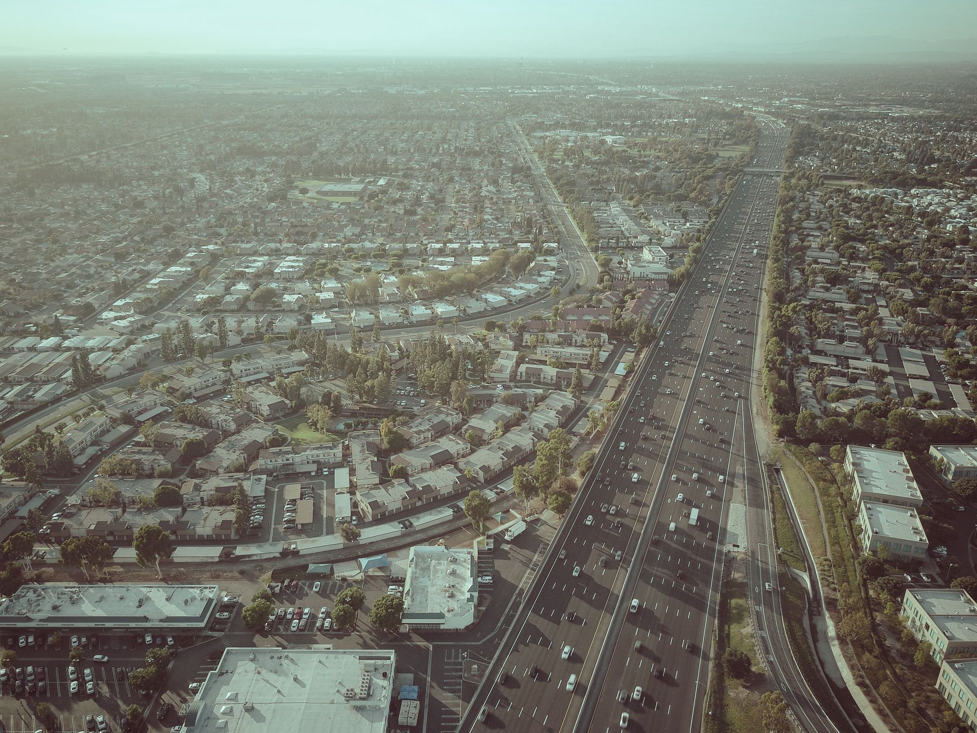 Aerial view of a Goodyear, Arizona subdivision beside the I-10 freeway used by West Valley commuters