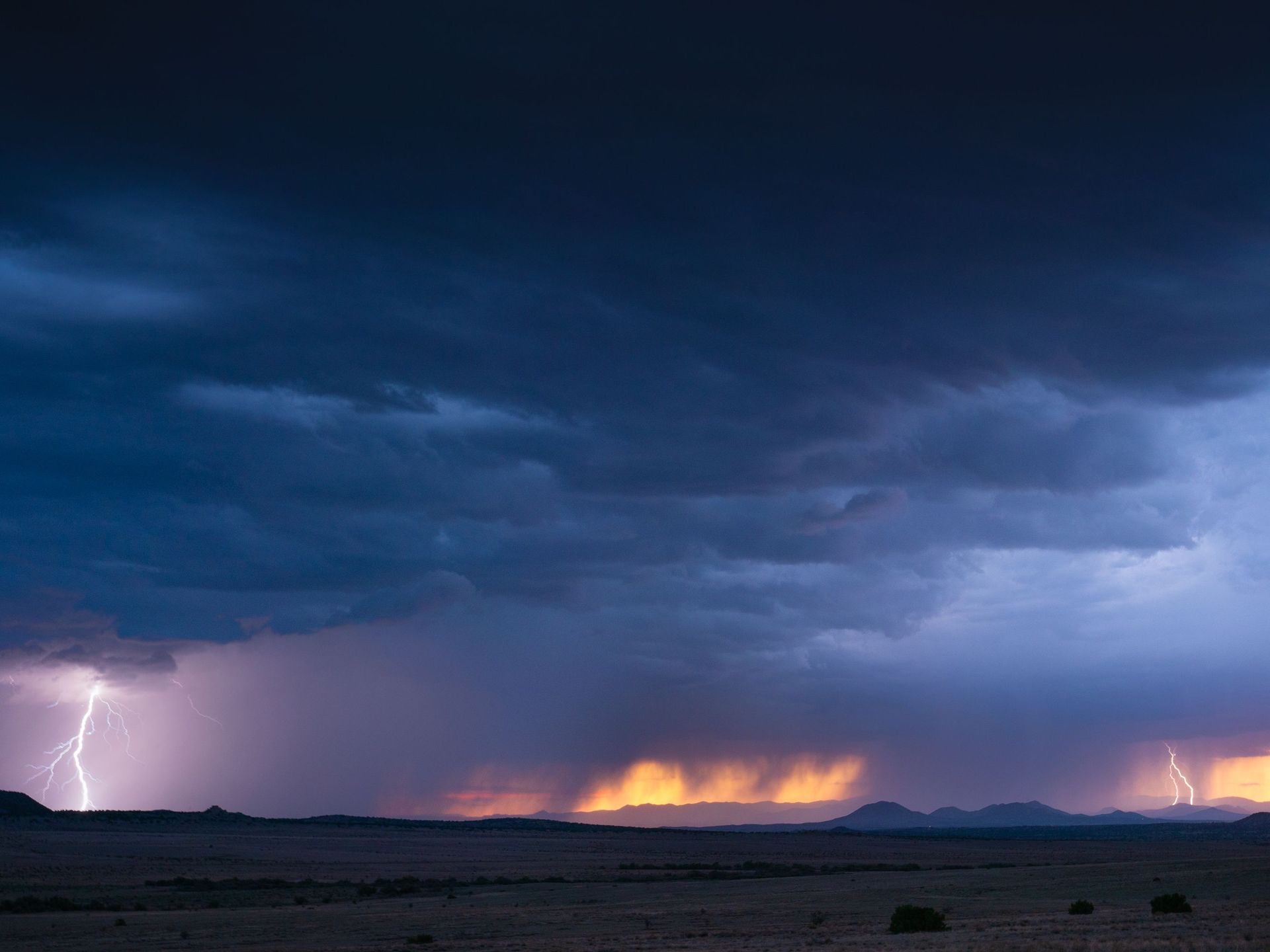 Monsoon lightning storm over homes near Maricopa, Arizona, the kind of wind and hail event a home insurance policy covers