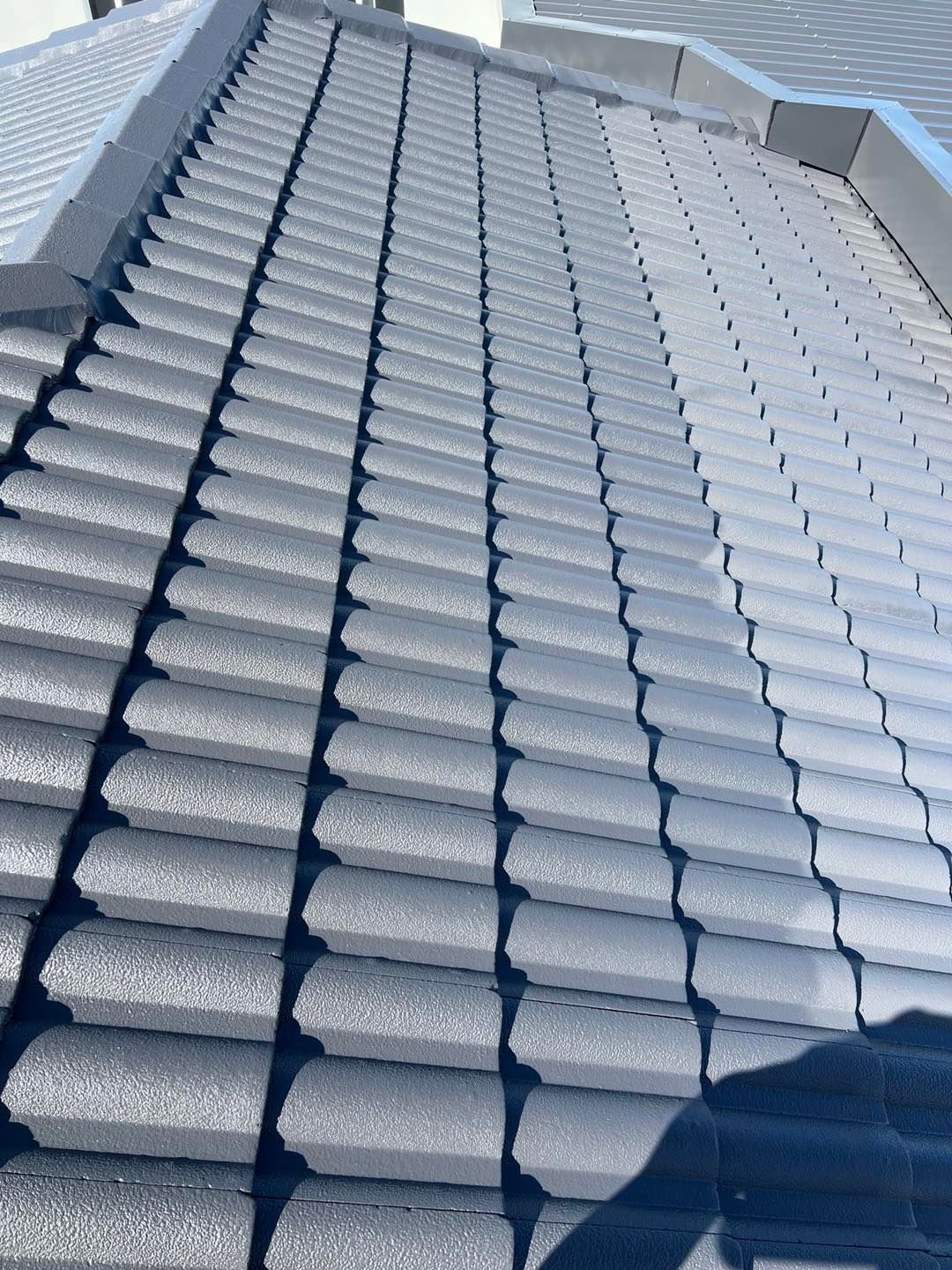 Gray Tiled Roof, Rows of Tiles Create Texture and Shadow — SEQ Roofing & Painting in Pacific Pines, QLD