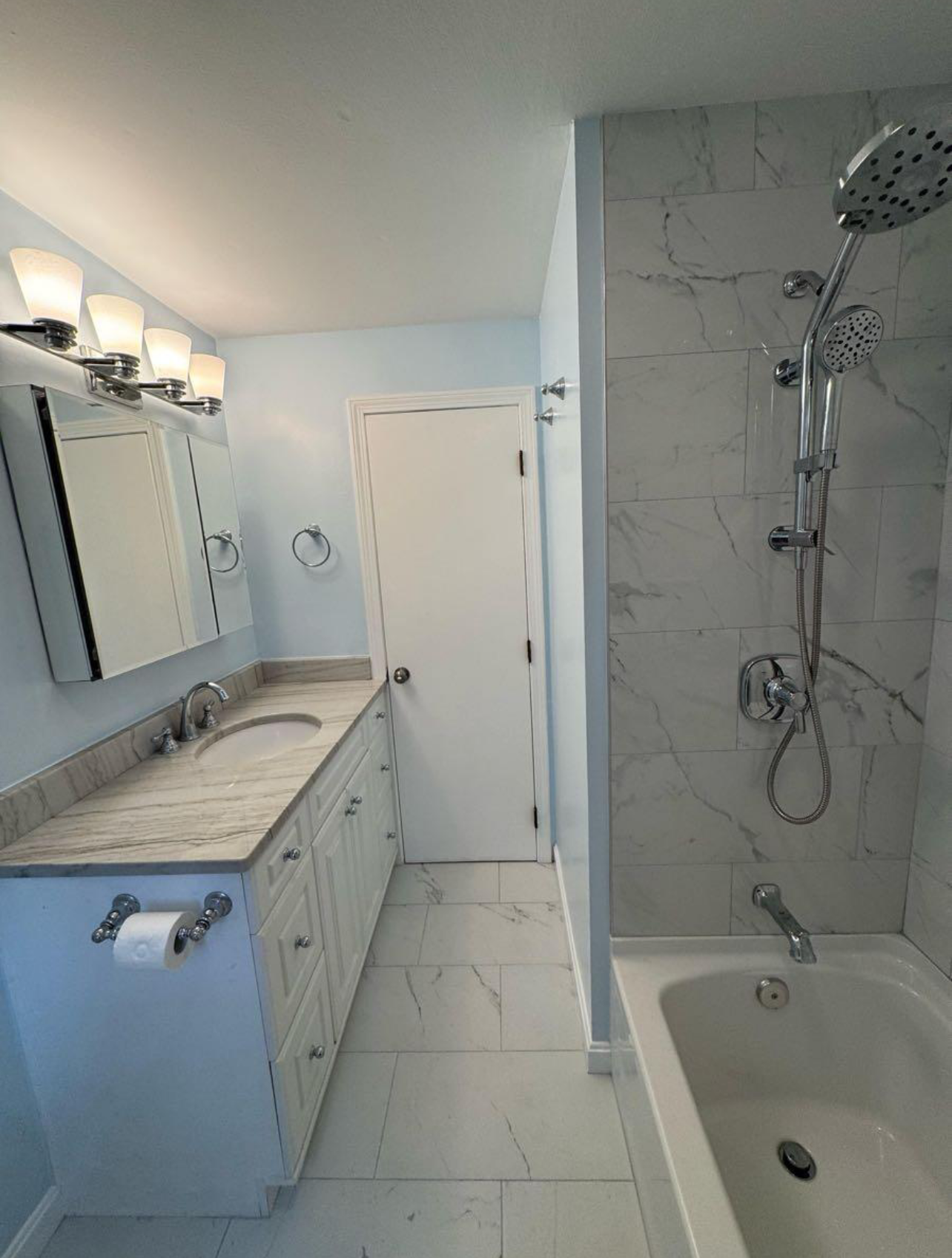 Finished bathroom tile work and walk-in shower installation in a South Florida home