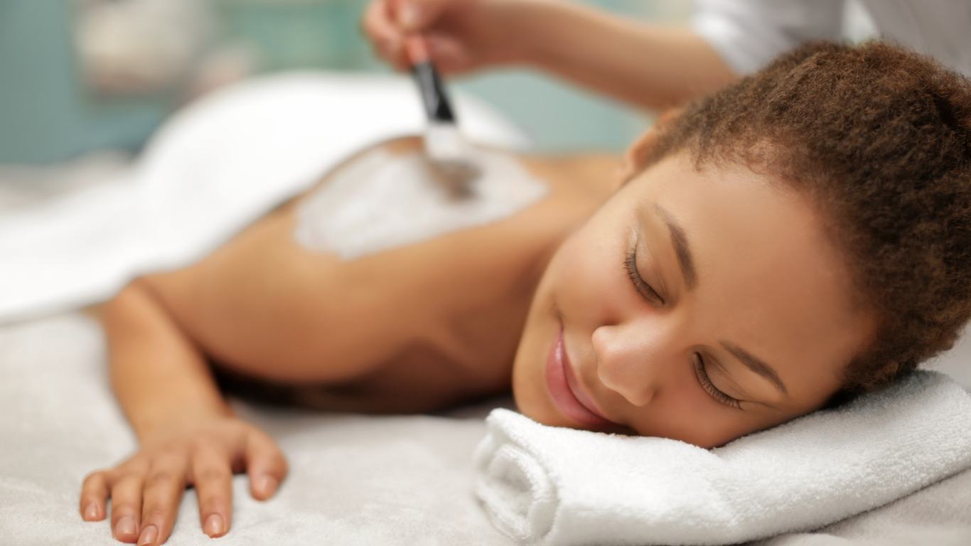 A woman is getting a massage at a spa.