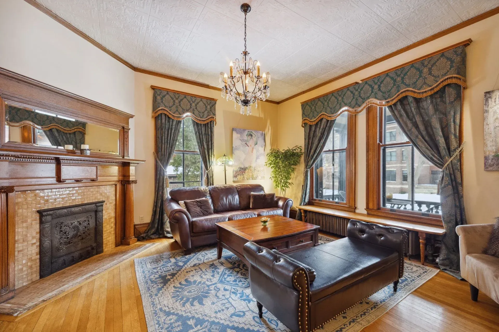 A living room with a couch , coffee table and fireplace