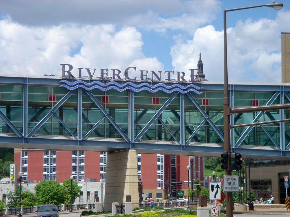 A bridge over a river that says river center