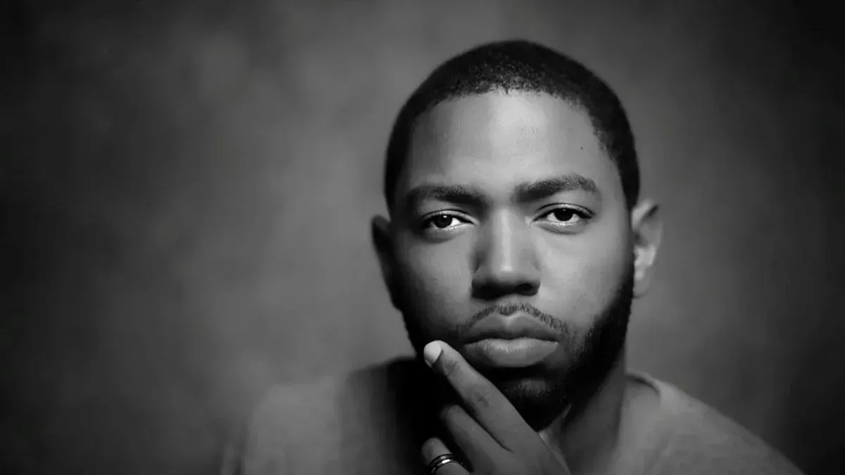 Black-and-white portrait of Conrad Baird featured in Trinidad Guardian