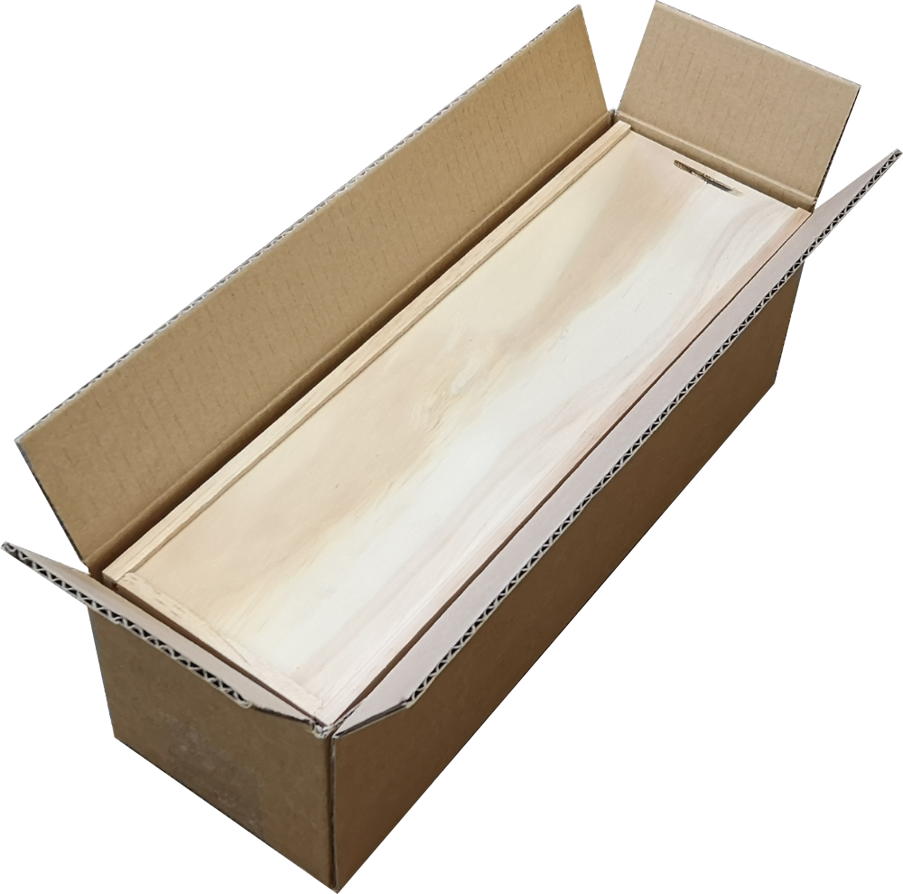 A cardboard box with a piece of wood in it