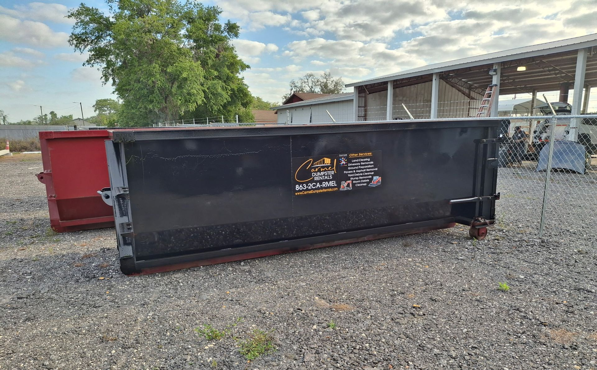 20 yard dumpster rental placed in a driveway for a home cleanout project in Lakeland, FL