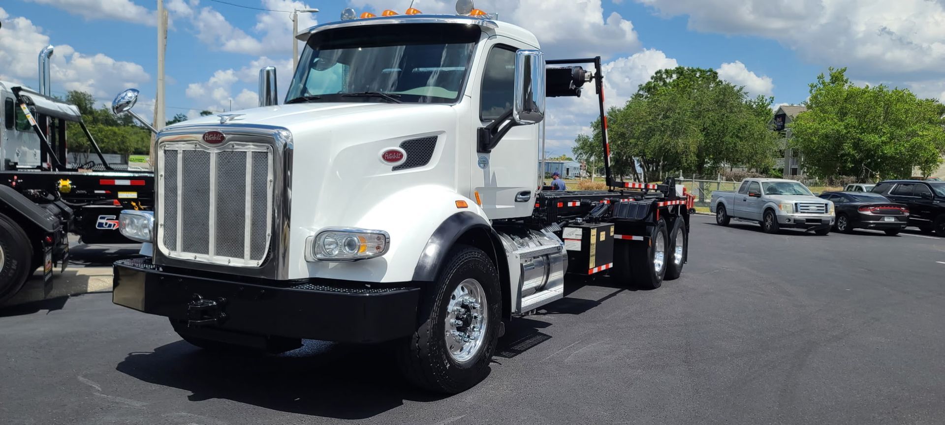 Roll off truck used to haul construction debris with 20 and 30 yard construction dumpster rentals